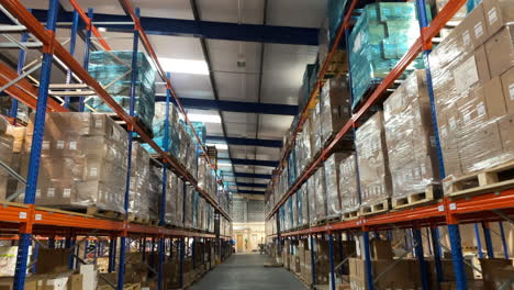 rising-shot-of-a-warehouse-interior-from-behind-a-pallet-truck