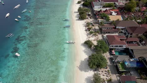 Aerial-shot-of-Gili-Trawangan-Beach-with-clear-water,parking-yachts-and-luxury-hotel-resort