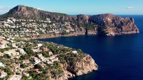 LLamp-Cape-near-Port-Andratx-in-Mallorca-Spain-with-seaside-homes-on-the-cliffs,-Aerial-dolly-right-reveal-shot