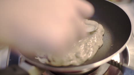 Experimental-oreo-pancake-batter-being-circled-on-pan