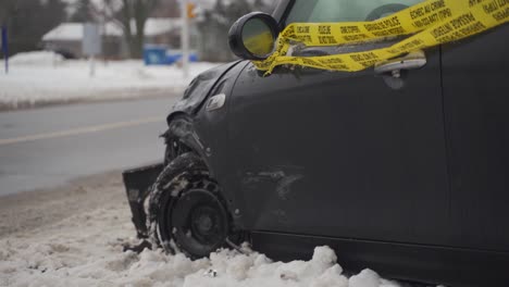 Crashed-car-side-view-mini-cooper-on-road-in-the-snow