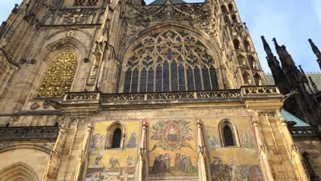 Approaching-front-gate-of-St-Vitus-Cathedral-in-Prague,-tilt-down