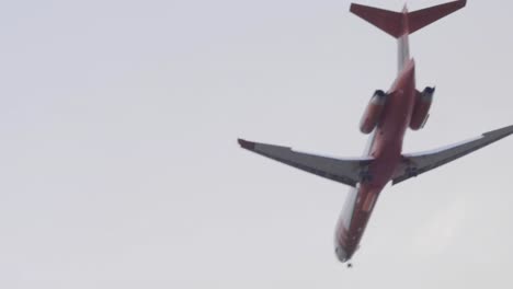 A-Cal-Fire-McDonnell-Douglas-MD-87-tanker-plane-flies-by-to-make-a-large-retardant-drop-on-the-Silverado-Fire-in-Southern-California