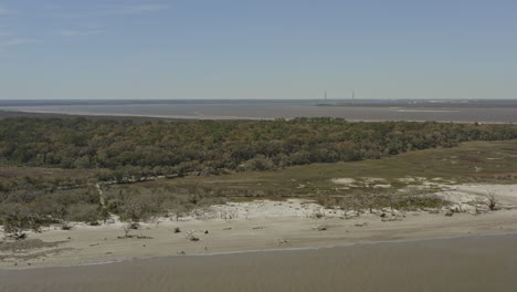 Jekyll-Island-Georgia-Aerial-v1-pan-left-shot-of-forest,-beach-and-Atlantic-Ocean---March-2020