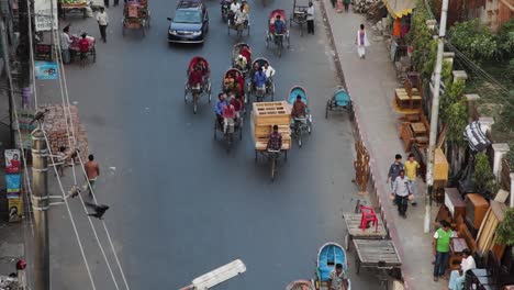 Rickshaw-and-Tuk-Tuk-Drivers-Going-Past-On-Road-In-Chittagong