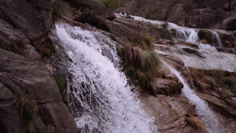 Slow-pan-of-cascading-waterfall-in-slow-motion-medium-shot