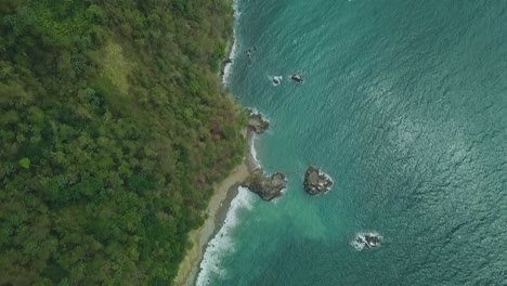 Drone-shot-of-ocean-shore-line-just-over-Mount-Dillon-lookout-in-Tobago,-West-Indies