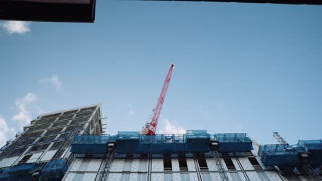 Red-Crane-at-construction-site-City-Centre-Sheffield,-South-Yorkshire