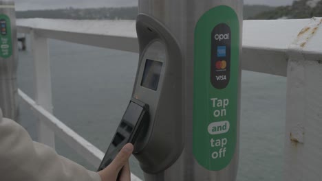 Commuter-With-Cellphone-Tapping-On-And-Tapping-Off-At-Opal-Reader---Contactless-Payment---Sydney,-NSW,-Australia