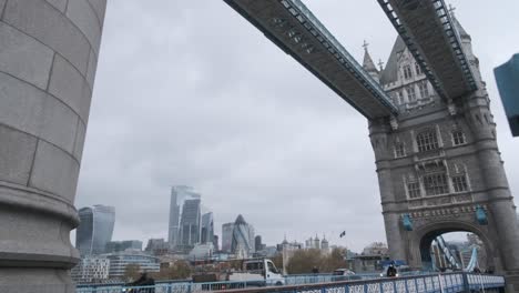 Wide-shot-of-tower-bridge-London-on-a-rainy-cloudy-day-wearing-masks-for-covid-19