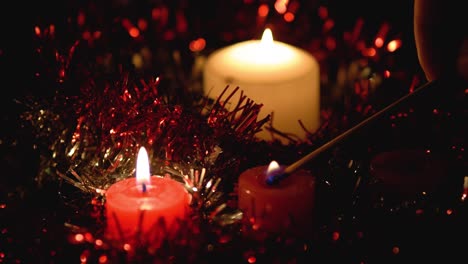 Lit-Christmas-candles,-with-room-for-copyspace