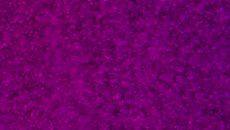 Purple-soda-like-bubbles-rising-slowly