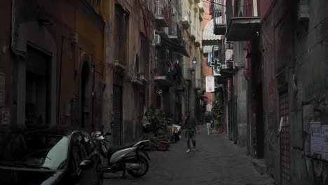 Alley-between-old-buildings-in-downtown-Naples,-Italy,-slow-motion