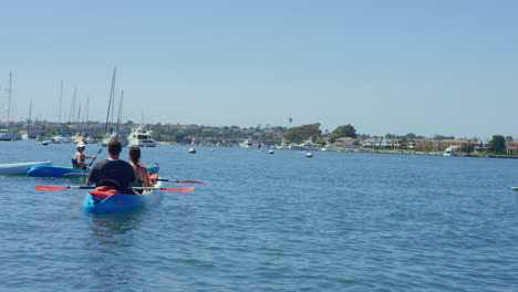 Slow-motion-Kayakers-and-Stand-Up-Paddle-Boarders-on-a-Sunny-Day-in-the-Harbor