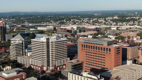 Aerial-of-Wilmington-Delaware-skyline,-Christina-River,-Chase-Bank-buildings-during-summer-golden-hour,-home-of-Vice-President-Joe-Biden