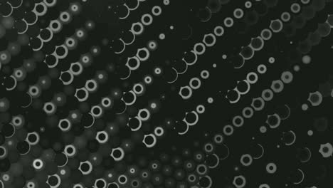 Small-Glittering-Circles-Moving-Seamless-Loop-On-Black-Background---Closeup-Shot