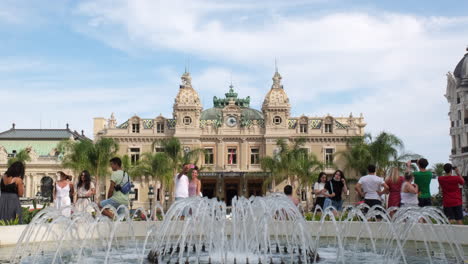 Crowd-of-people-and-tourists-taking-selfie-at-the-Grand-Casino-Square-in-Monaco,-Monte-Carlo,-France