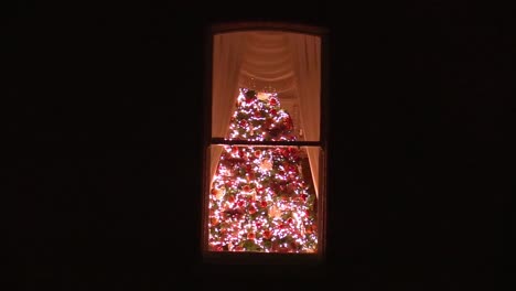 Still-video-of-a-Christmas-tree-in-a-Dublin-house-in-December-with-lights-and-decorations