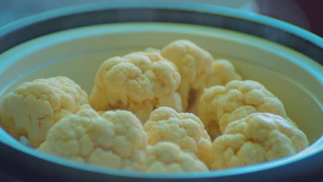 Covering-Dish-Bowl-and-Cooking-White-Cauliflowers-Close-Up