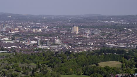 Aerial-flyover-of-west-Belfast-from-the-countryside-looking-towards-the-city-centre-or-center