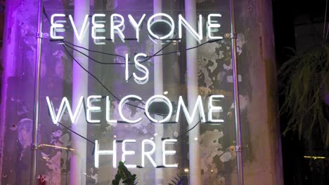 Everyone-is-Welcome-Here-Vintage-Neon-Electric-Sign-in-New-York-USA,-Close-Up