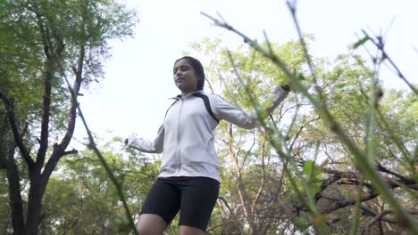Athletic-Beautiful-Woman-Exercises-with-Jump,-Skipping-Rope-in-the-forest