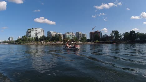False-Creek-DT-BC-Canada-Olympic-Village-harbor-where-Canadians-relax-on-an-inflatable-boat-sipping-side-by-side-consuming-lots-of-alcohol-despite-COVID19-physical-social-physical-distancing-dingy2-7