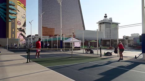 Couple-Warming-Up-At-Pickleball-Tournament