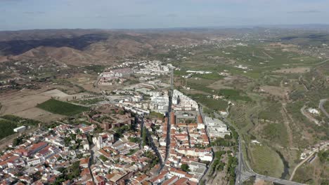 Grand-shot-seeing-the-whole-town-of-Silves-at-great-altitude-from-drone-on-a-sunny-day