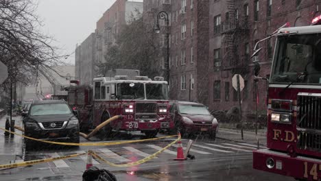 FDNY-Fire-Engines-at-intersection-during-snowstorm-attending-Brooklyn-accident---Wide-shot