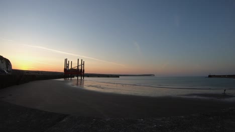 Sunrise-time-lapse-at-Newhaven.-Man-looking-for-worms