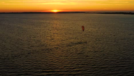 Aerial-view-young-people-kite-surfing-in-the-Baltic-Sea,-Gdansk