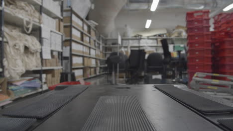 Point-of-view-from-intelligent-and-autonomous-mobile-industrial-robot-moving-in-warehouse
