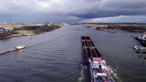 Six-Cargo-Barge-With-Pushtow-At-Oude-Maas-River-Near-Puttershoek-In-Netherlands-With-Overcast