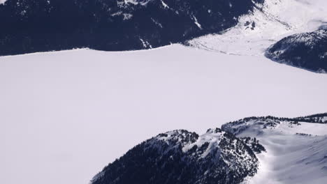Forest-Mountain-With-Frozen-Garibaldi-Lake-In-British-Columbia,-Canada