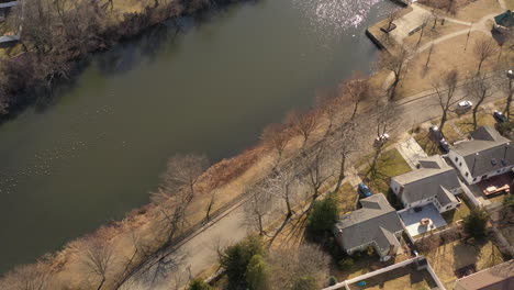 An-aerial-shot-of-a-pond-in-a-suburban-neighborhood-on-Long-Island,-NY