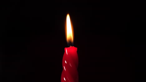 Red-candle-light-on-black-background