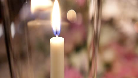 Close-Up,-Single-Thin-Candle-Stick-Flaming-Inside-Glass-At-Wedding-Celebration