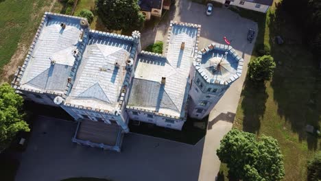 Vecauce-Manor-in-Latvia-Aerial-View-of-the-Pink-Castle-Through-the-Park