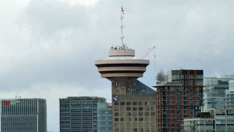 Static-wide-shot-of-famous-Vancouver-Lookout-Tower-in-Downtown-during-clouds-moving-in-background