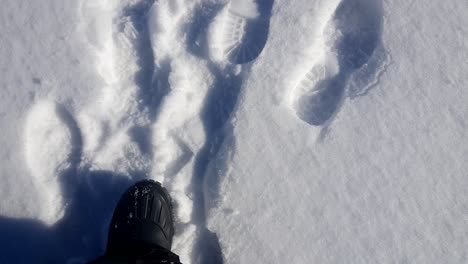 Man-walking-on-snow-,-climbing-to-success,-beautiful-clean-snow-peak
