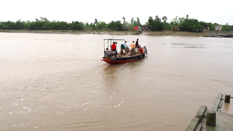 People-crossing-a-river-by-wooden-boat-in-Sunderban-Bengal,-Kolkata,-India-in-HD