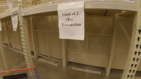 Empty-shelves-for-packages-of-bottled-drinking-water-and-purchase-limits-at-HEB-grocery-store