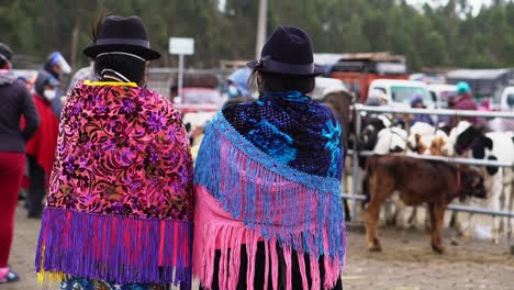 Couple-of-women-wearing-typical-Equador-dresses-in-farmstead-event