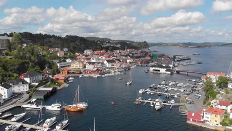 Scenic-drone-shot-of-Kragero-town-marina,-Norway---tourism-hotspot