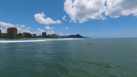 Waiting-for-the-Swell,-Aerial-Drone-FPV-Shot-over-Surfers-on-Gorgeous-Blue-Water-of-Oahu