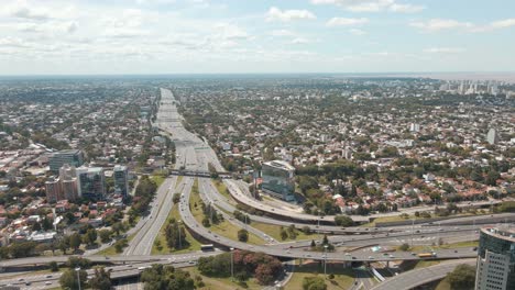 Aerial-panning-shot-revealing-Panamericana-highway-and-General-Paz-avenue-interchange