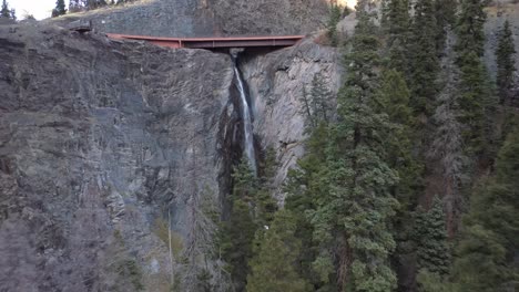 Bear-Creek-Falls-in-Ouray,-Colorado-along-the-Million-Dollar-Highway-with-drone-video-moving-forward