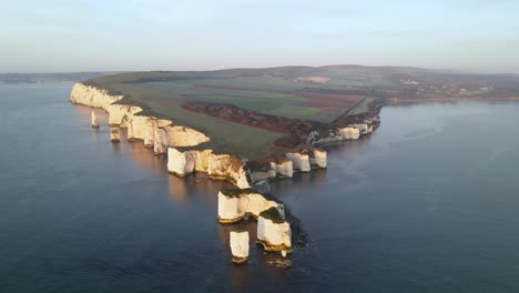 Old-Harry-Rocks-cliffs-and-green-English-countryside,-Dorset-in-UK