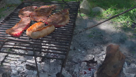 Argentinian-barbecue,-tradicional-asado.-Tidying-up-the-embers